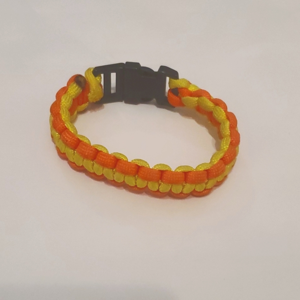 Orange & Yellow Paracord Bracelet. It is also known as a Survival Bracelet